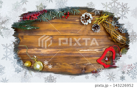 Christmas wooden background with snow branch. Top view with copy space for your text Christmas wooden background with snow branch. Top view with copy space for your text 143226952