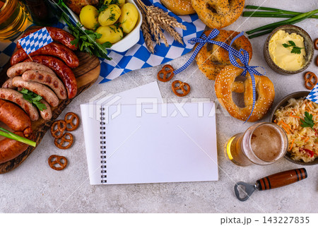 Oktoberfest food: beer, pretzel, sausages, stewed cabbage, potato Oktoberfest food: beer, pretzel, sausages, stewed cabbage, potato 143227835