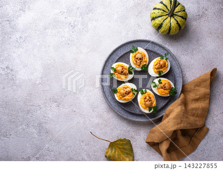 Deviled Eggs decorated with skull 143227855