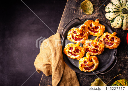Halloween mini pies in shape of pumpkin Jack-o-lantern Halloween mini pies in shape of pumpkin Jack-o-lantern 143227857