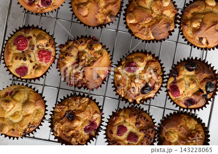 Assorted Homemade Muffins with Berries Nuts and Chocolate 143228065