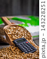 Wood Pellets And Calculator On Table Representing Biofuel Heating Costs And Renewable Energy Budgeting 143228251