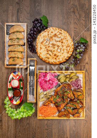 Overhead flat lay of a rustic feast Overhead flat lay of a rustic feast 143228450