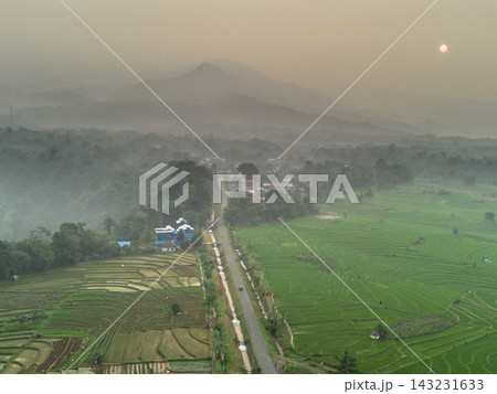 beauty morning light sunrise at paddy fields asia, Beautiful morning view in Indonesia, panoramic landscape of rice fields with mountain ranges and clear sky 143231633