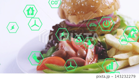 Showcasing centered white plate on tabletop with sesame burger, fries, salad, green hexagon icons Showcasing centered white plate on tabletop with sesame burger, fries, salad, green hexagon icons 143232279