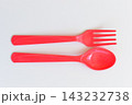 red spoon and fork isolated on white background, plastic cutlery for picnic 143232738