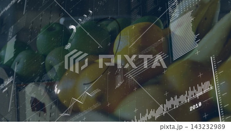 Displaying green and yellow mango-like fruits in market crate left with glossy glass, 2018 overlays 143232989