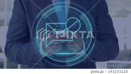Holding man in navy suit and tie viewing smartphone at office, showing hologram envelope badge 143233220