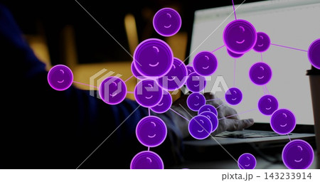 Showing purple molecular net covering laptop, right forearm in dark sleeve at home desk, coffee cup 143233914
