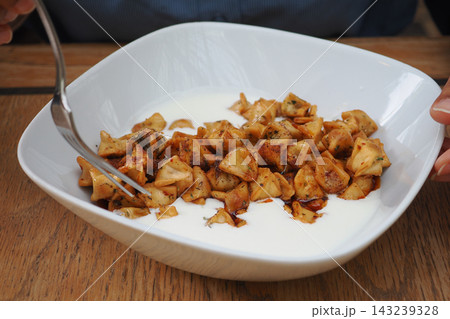 Turkish-style small meat-filled dumplings in a bowl Turkish-style small meat-filled dumplings in a bowl 143239328