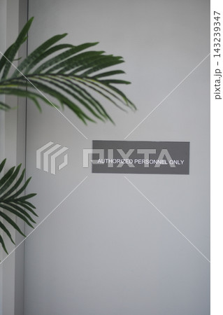 Sign on a wall indicating restricted access in an indoor area Sign on a wall indicating restricted access in an indoor area 143239347