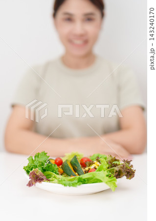 happy smiling woman with fresh organic vegetables plate. healthy nutrition, weight loss, clean eating, Healthy food eating, Vegan, Wellness, Green dieting and Healthy lifestyle happy smiling woman with fresh organic vegetables plate. healthy nutrition, weight loss, clean eating, Healthy food eating, Vegan, Wellness, Green dieting and Healthy lifestyle 143240170