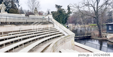 Stone spectator seating of the open-air Roman amphitheater in Lazienki Park, Warsaw - Warsaw, Poland - January 26, 2023 143240806