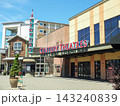 Main entrance of Century Theatres cinema building with a tall retro neon sign tower at Point Ruston. - June 13, 2026 Ruston WA, USA 143240839