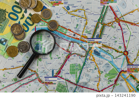Exploring a travel budget with maps and money for planning trips 143241190
