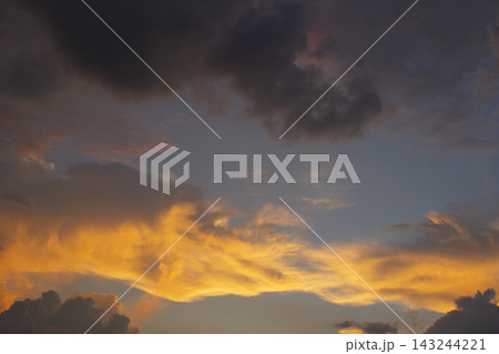 It is an atmospheric sunset sky. It is an atmospheric sunset sky. 143244221