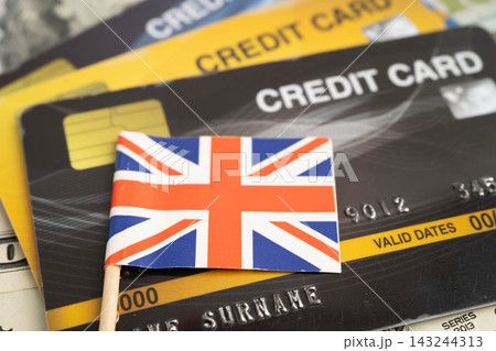UK flag on coin and banknote money, finance trading investment business currency. UK flag on coin and banknote money, finance trading investment business currency. 143244313