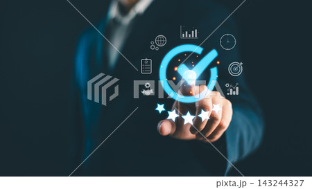 Businessman touching digital checkmark icon with five stars and business growth icons, quality assurance, standard control, customer satisfaction, service rating, success and compliance concept 143244327