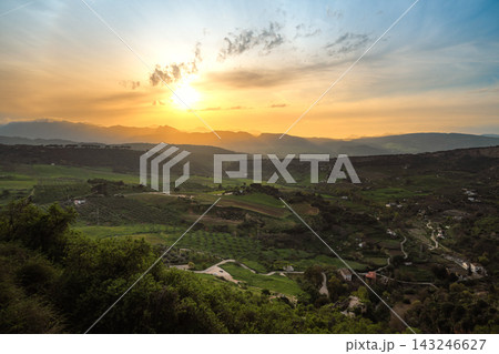 Golden sunset over rolling hills and farmland in the Ronda countryside, Spain Golden sunset over rolling hills and farmland in the Ronda countryside, Spain 143246627