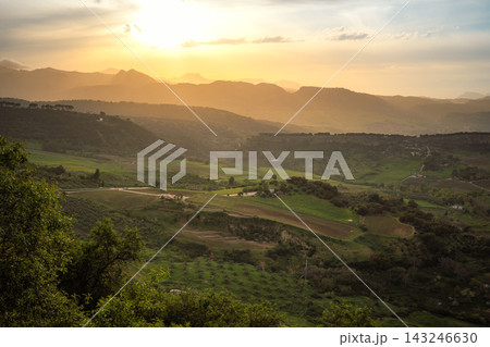 Golden sunset over rolling hills and farmland in the Ronda countryside, Spain Golden sunset over rolling hills and farmland in the Ronda countryside, Spain 143246630