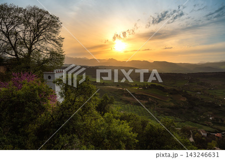 Golden sunset over rolling hills and farmland in the Ronda countryside, Spain Golden sunset over rolling hills and farmland in the Ronda countryside, Spain 143246631