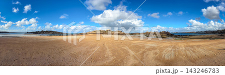 Brown sand plateau meeting granite formations in Tregastel Brittany France. Panoramic view 143246783