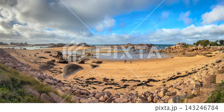 Sandy bay with granite reefs and tidal pools in Tregastel,France. Panoramic view 143246784