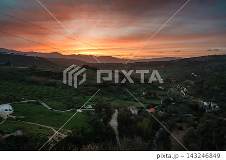 Vibrant sunset over rolling farmland and mountains outside Ronda Vibrant sunset over rolling farmland and mountains outside Ronda 143246849