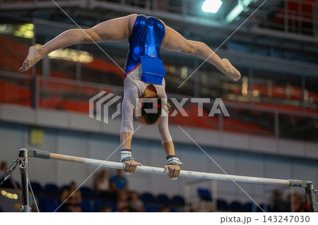 Female gymnast performing handstand split 143247030