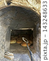 Traditional Bread Baking in Rustic Stone Oven. Traditional Bread Baking in Rustic Stone Oven. 143248633