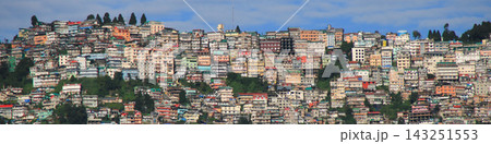 Dense together build houses on a steep hill, East side of Darjeeling seen from Dawapani. 143251553