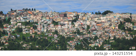 Dense build colorful houses on a steep hill, East side of Darjeeling seen from Dawapani. 143251554