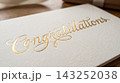 Extreme close up detail focusing on the luxurious texture of a gift card resting on a book cover 143252038