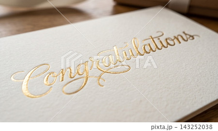 Extreme close up detail focusing on the luxurious texture of a gift card resting on a book cover 143252038