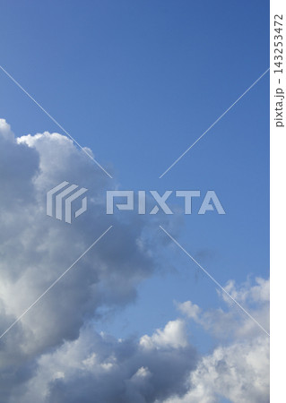 It is a blue sky with fluffy clouds. It is a blue sky with fluffy clouds. 143253472