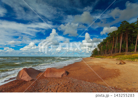 The Dutchman's Cap Nature Trail near Klaipeda in Lithuania. Beautiful beach with big stones near the sea The Dutchman's Cap Nature Trail near Klaipeda in Lithuania. Beautiful beach with big stones near the sea 143255283