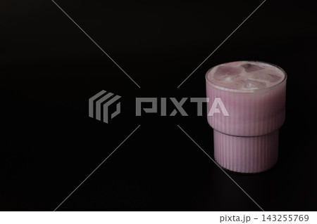 Pink Iced Matcha Drink With Ice Cubes on Dark Background Pink Iced Matcha Drink With Ice Cubes on Dark Background 143255769