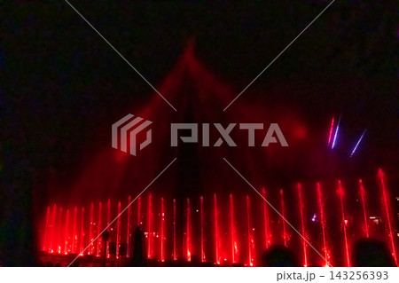 Night shot of the illuminated Thun Water Magic dancing fountain show with colorful lights in Thun, Switzerland 143256393