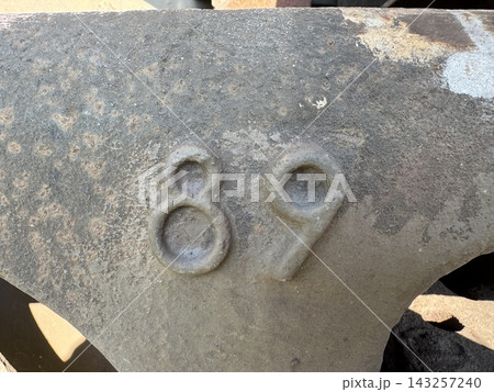 Number eighty nine embossed on aged rusted metal industrial surface Number eighty nine embossed on aged rusted metal industrial surface 143257240