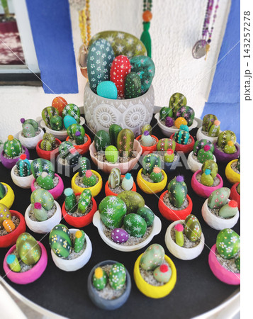 Hand-painted stone cacti in colorful miniature pots in Turkey 143257278
