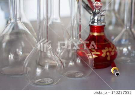 composition of red hookah and chemical glass flasks composition of red hookah and chemical glass flasks 143257553