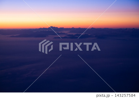 beautiful thick clouds in the sky from the height of the flight of the airplane with a view of the sunset beautiful thick clouds in the sky from the height of the flight of the airplane with a view of the sunset 143257584