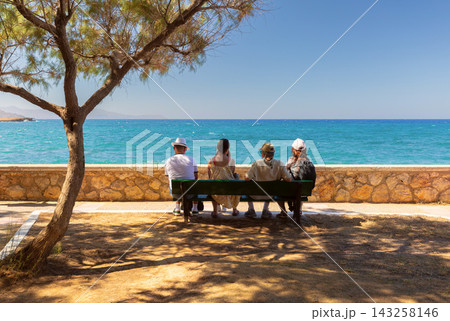 Tourists relaxing by the Mediterranean Sea in Chania, Crete, Greece 143258146
