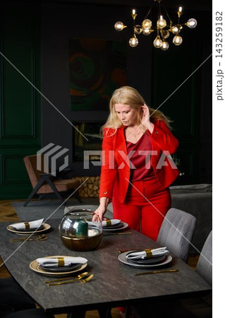 Sophisticated dining scene featuring luxurious decor and lighting 143259182