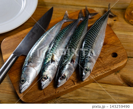 Sardines on plate served with parsley, ready to serve Sardines on plate served with parsley, ready to serve 143259490