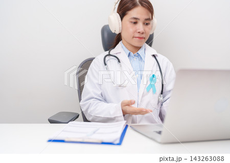 doctor using laptop for telehealth, online consultation and meeting about blue Ribbon concept of November Prostate Cancer Awareness month, Diabetes day , Men Health, International men, Father day. 143263088
