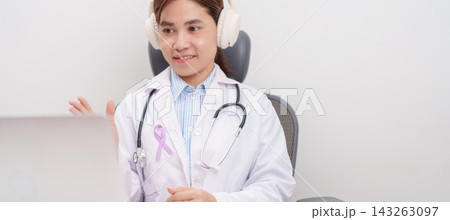 doctor using laptop for telehealth, online consultation and meeting about light purple ribbon for concept of All cancer, April Esophageal Cancer, November gastric and Stomach cancer, Hodgkin Lymphoma 143263097