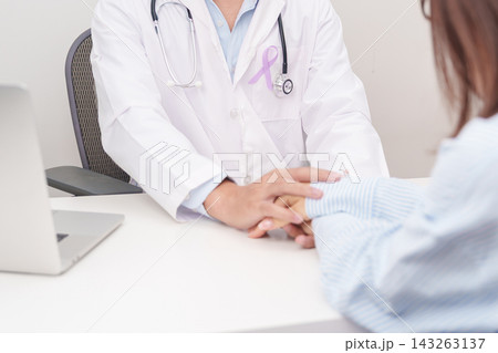 doctor holding patient hand to comfort and support with empathy. light purple ribbon for concept of All cancer, April Esophageal Cancer, November gastric and Stomach cancer, and World cancer day doctor holding patient hand to comfort and support with empathy. light purple ribbon for concept of All cancer, April Esophageal Cancer, November gastric and Stomach cancer, and World cancer day 143263137