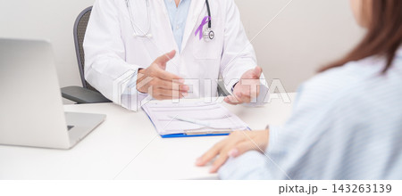 Doctor and patient having a medical consultation for purple ribbon for concept of Violence, Pancreatic, Esophageal, Testicular cancer, Alzheimer, Epilepsy, Lupus and Fibromyalgia. Awareness month 143263139