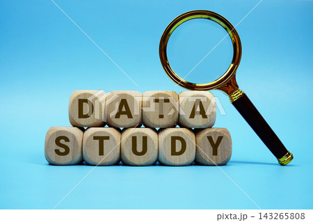 Data Study alphabet letters wooden cube and magnifying glass on blue background Data Study alphabet letters wooden cube and magnifying glass on blue background 143265808
